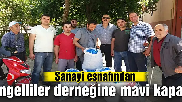 Sanayi esnafından engelliler derneğine mavi kapak