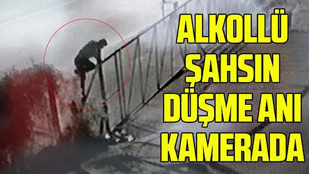 Alkollü şahsın tel örgülerin üzerinden geçerken düşme anı kamerada