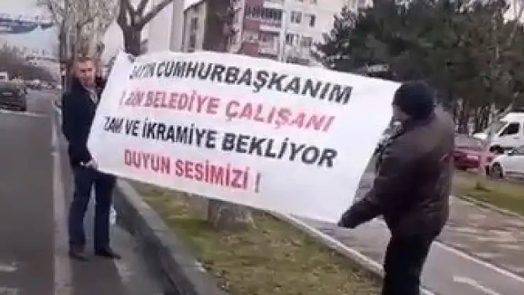 Belediye çalışanları pankart ile yardım istedi