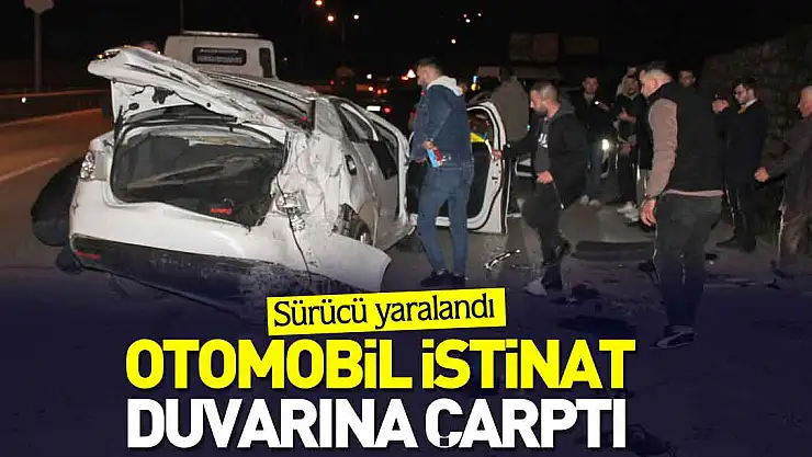 Otomobil istinat duvarına çarptı