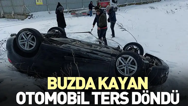 Buzda kayan otomobil ters döndü