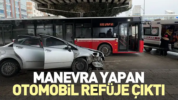 Manevra yapan otomobil refüje çıktı