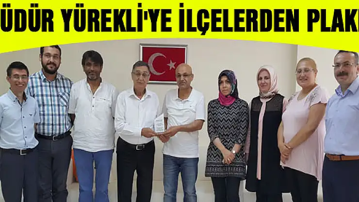 MÜDÜR YÜREKLİ'YE İLÇELERDEN PLAKET