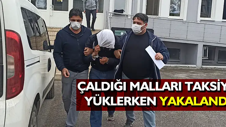 Çaldığı malları taksiye yüklerken yakalandı
