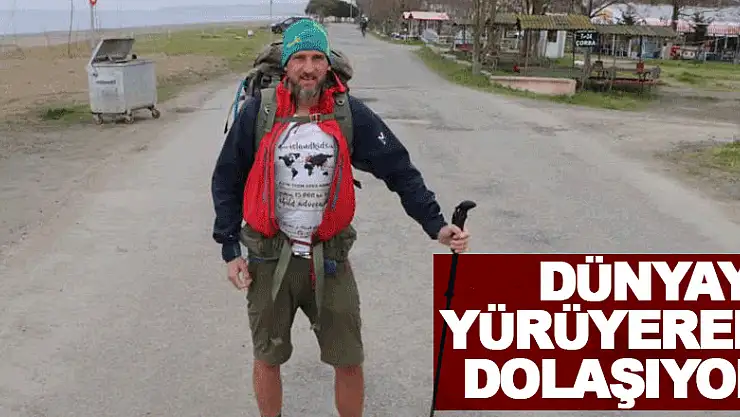 dünyayı yürüyerek dolaşıyor  