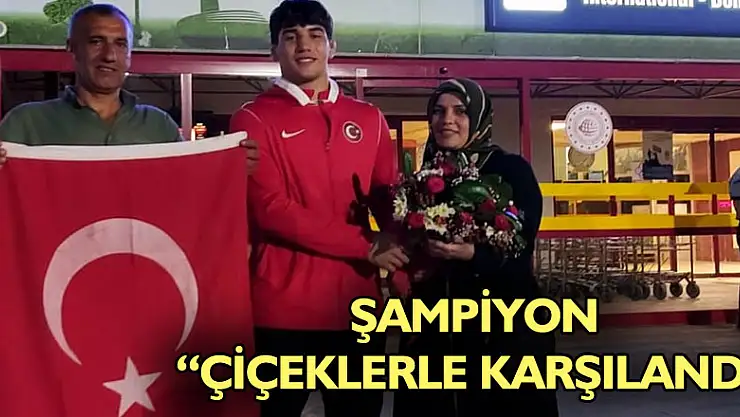 Şampiyon çiçeklerle karşılandı