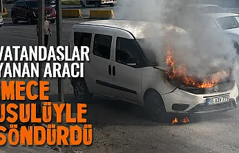 Vatandaşlar kovalarla su taşıdı, araç yanmaktan kurtuldu