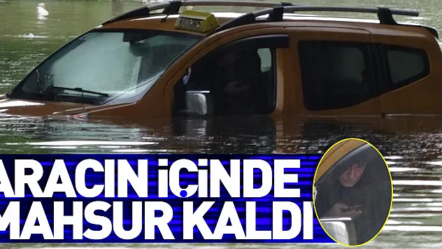 Samsun'da taksici selde aracıyla suyun içinde mahsur kaldı