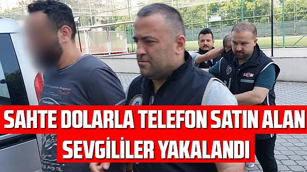 Sahte dolarla telefon satın alan sevgililer yakalandı