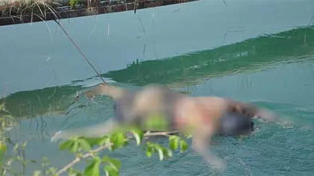 Kanalda gördüğü kadın cesedini ayağından bağladı