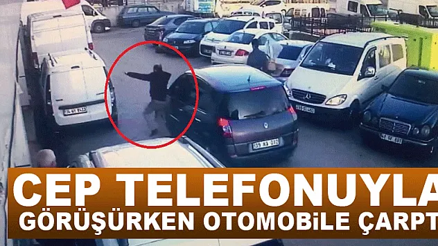 Cep telefonuyla görüşürken otomobile çarptı