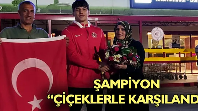 Şampiyon çiçeklerle karşılandı