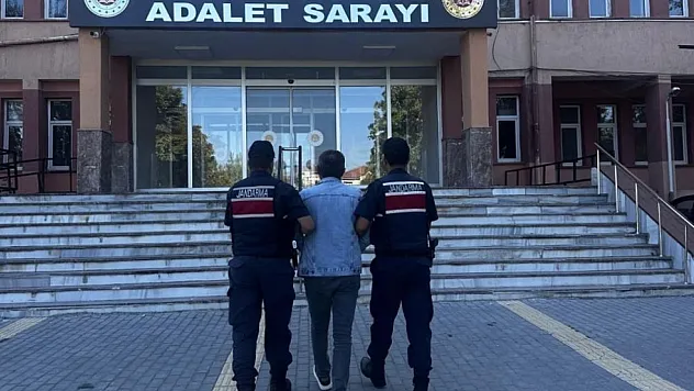 Aranan şahıs bazanın yanında yakalandı