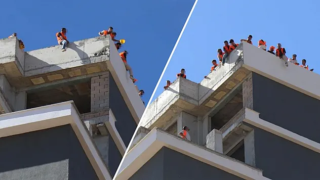 Denizli'de inşaat işçilerinden 15 katlı binanın çatısında hak arayışı